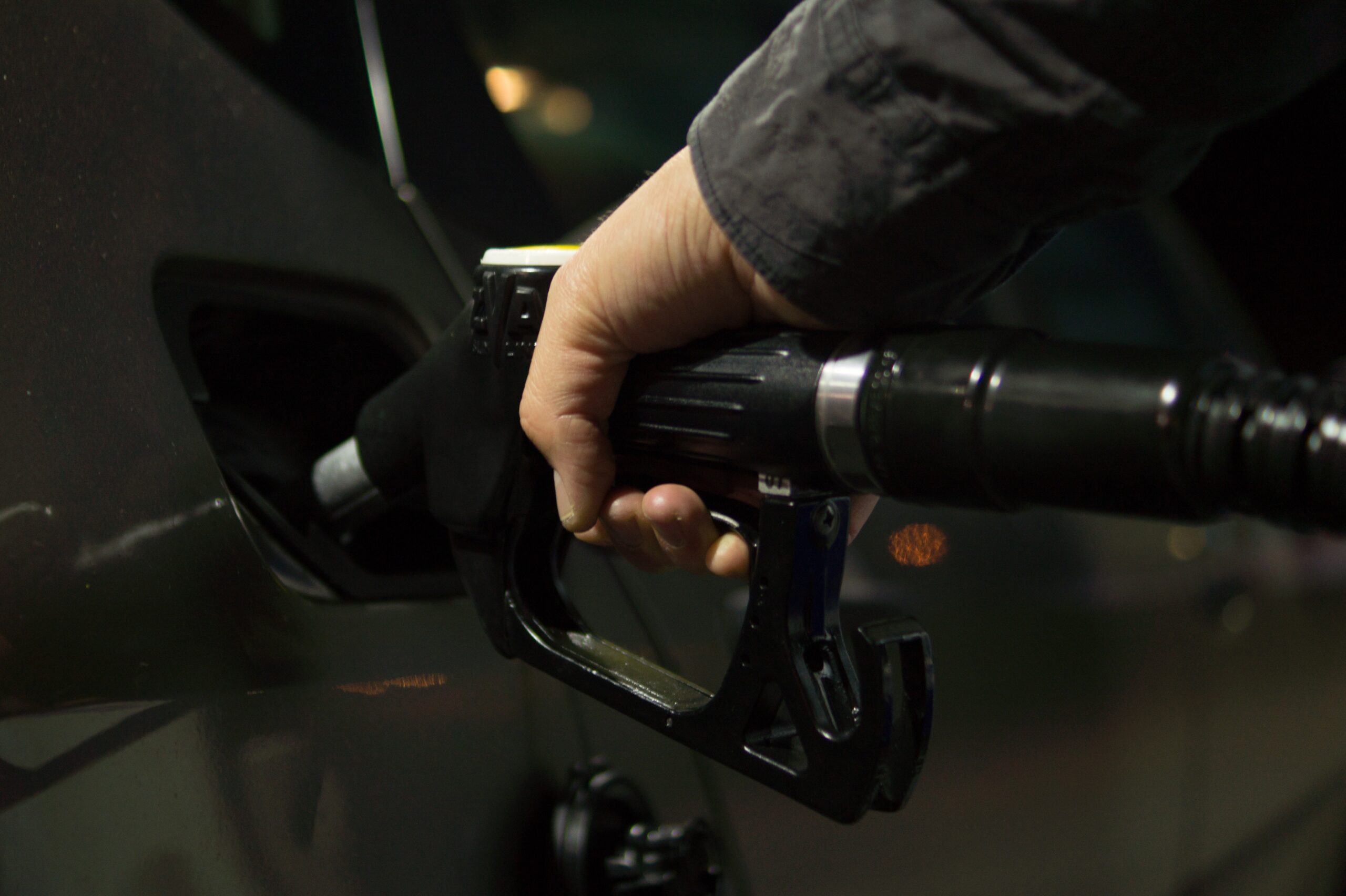 Person putting fuel in their car